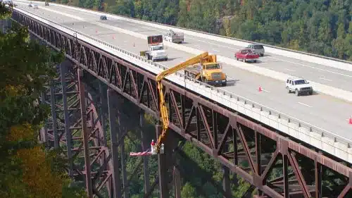 Paxton-Mitchell Snooper Truck Series 260 conducting bridge maintenance at the New River Gorge Bridge